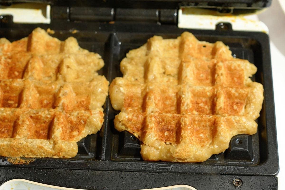 crispy oatmeal waffles on the waffle iron.