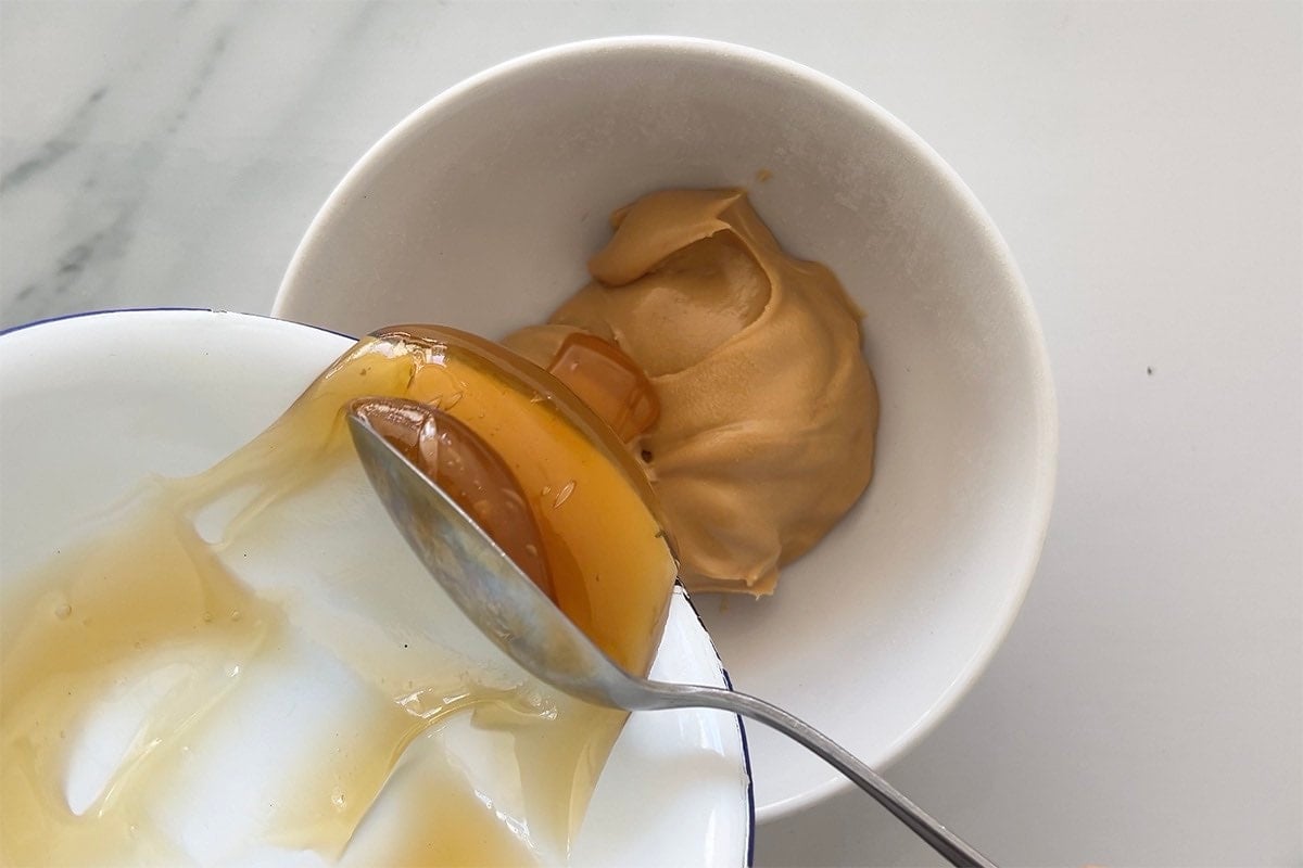 peanut butter and maple syrup microwaved in a bowl.