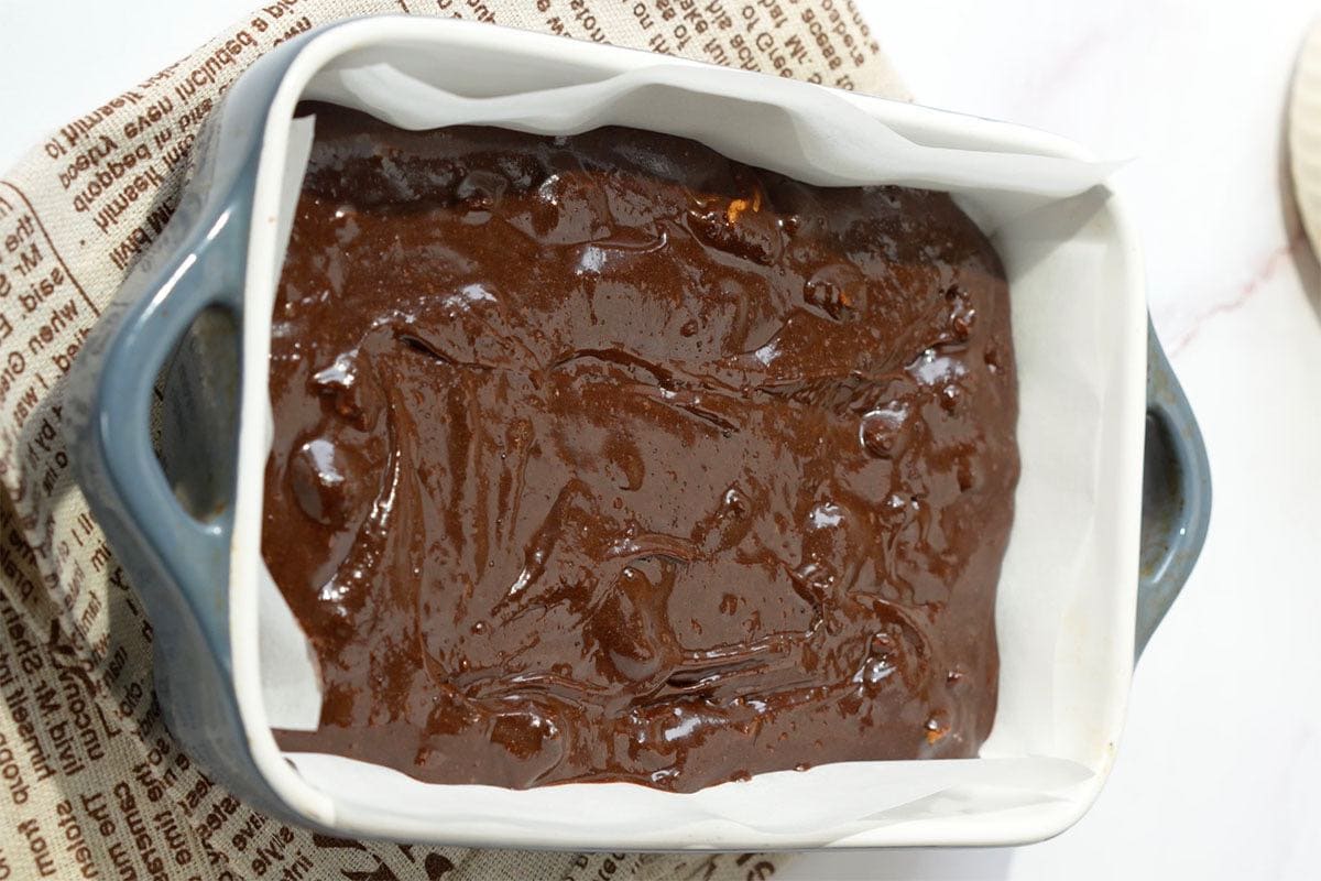assembled brownie batter in baking dish.
