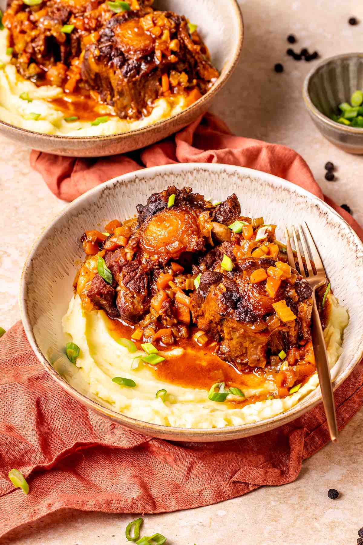 oxtail stew with mashed potatoes in bowls.