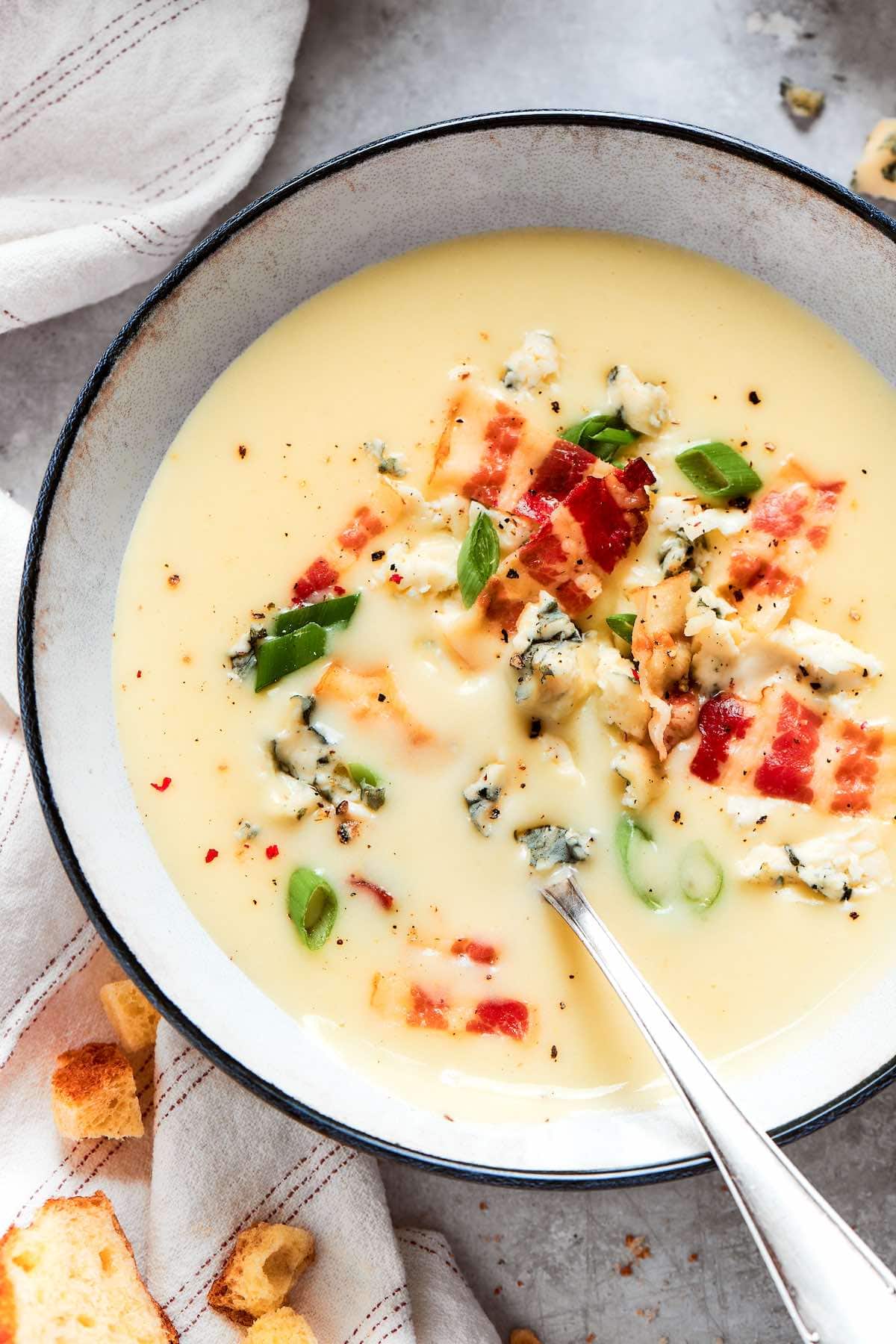 4 ingredient potato soup with blue cheese crumbled on top.