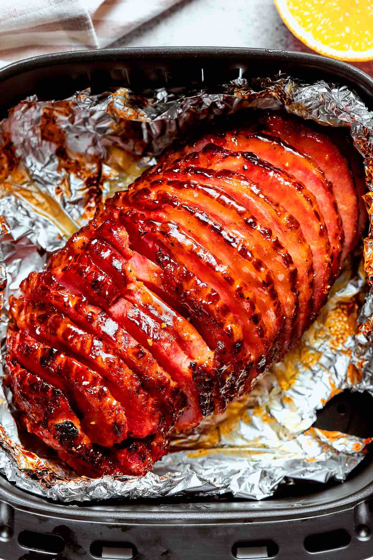 air fryer ham in air fryer basket.