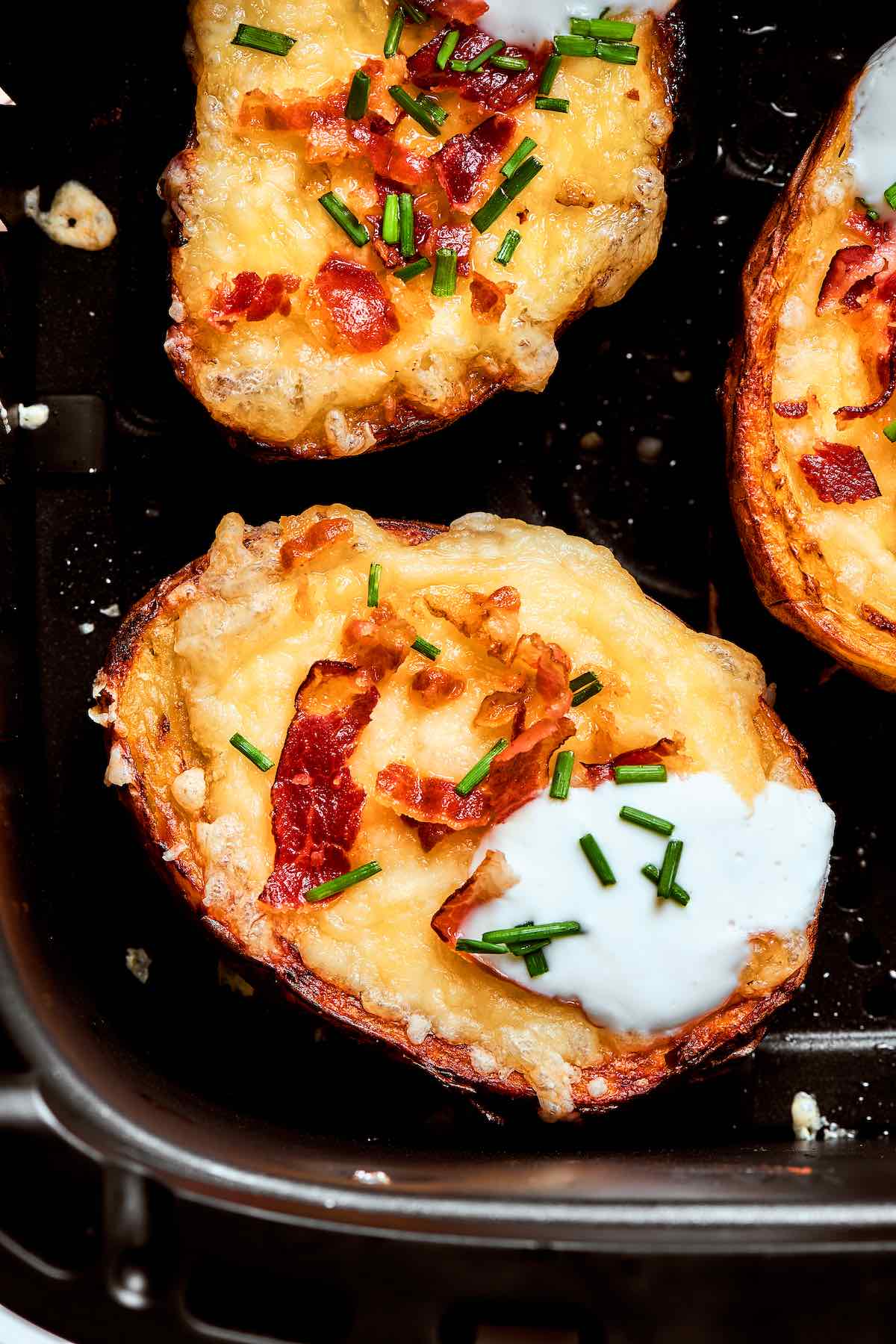 air fryer potato skins in the air fryer basket.