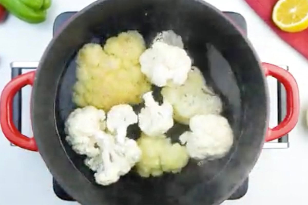 steaming cauliflower in a pot.