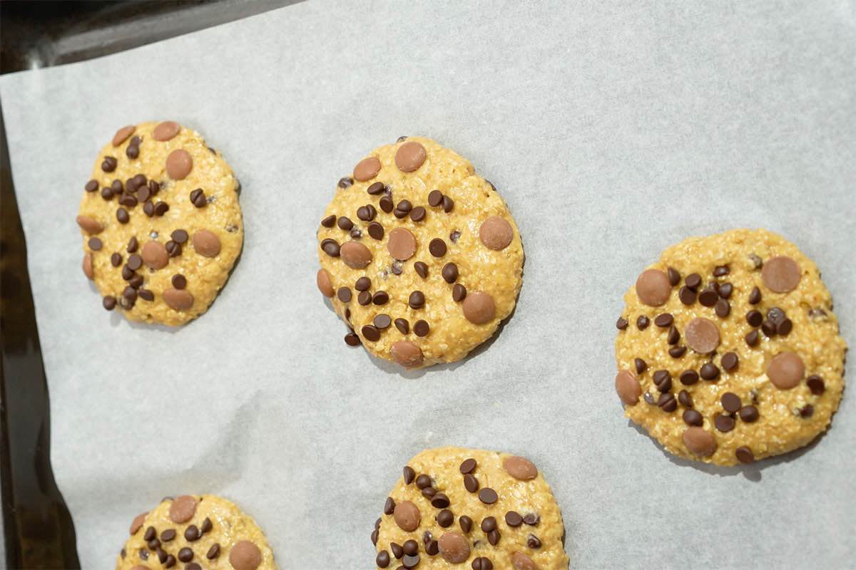shaped unbaked cookies on a baking sheet.