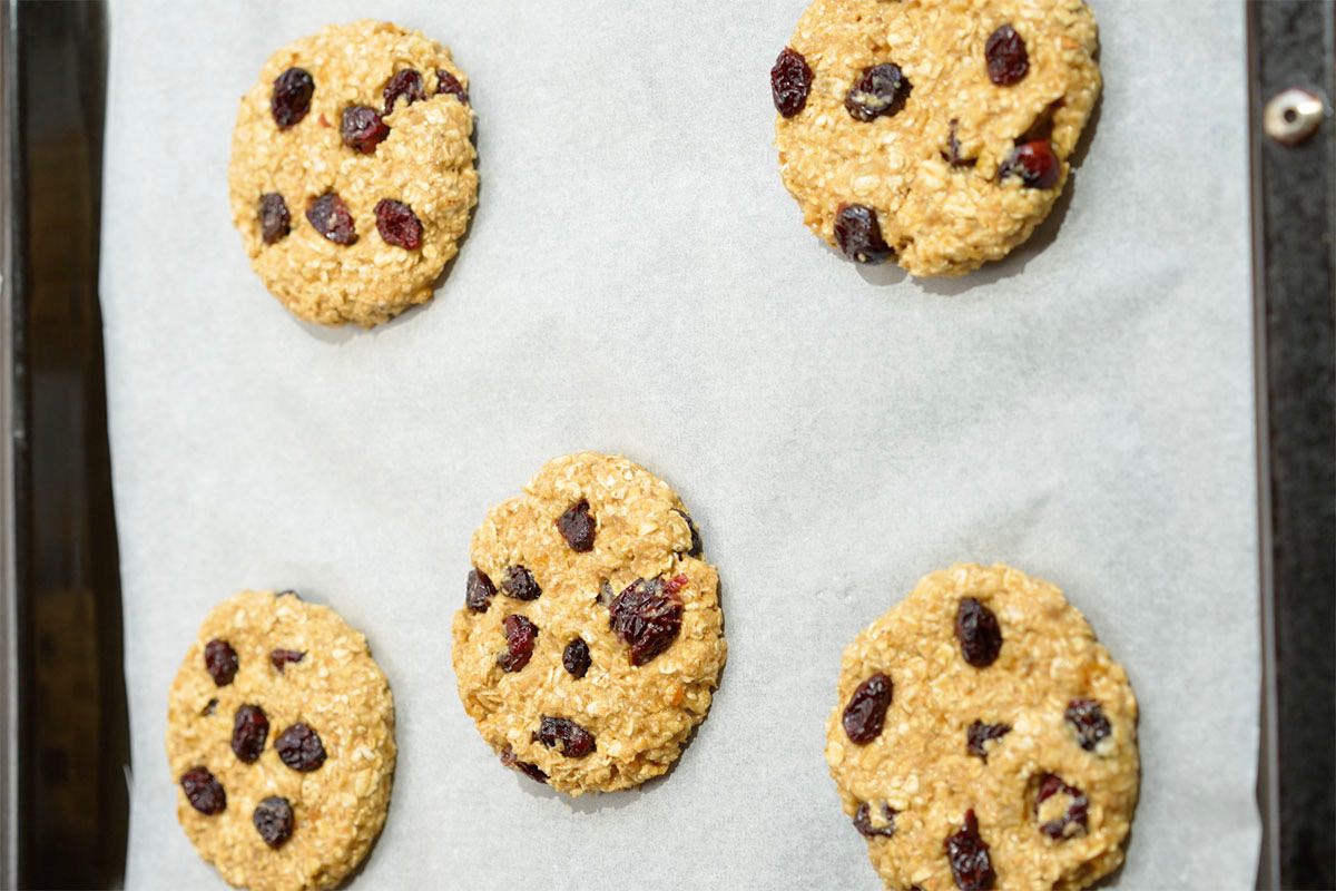 shaped un-baked cookies on a baking sheet.