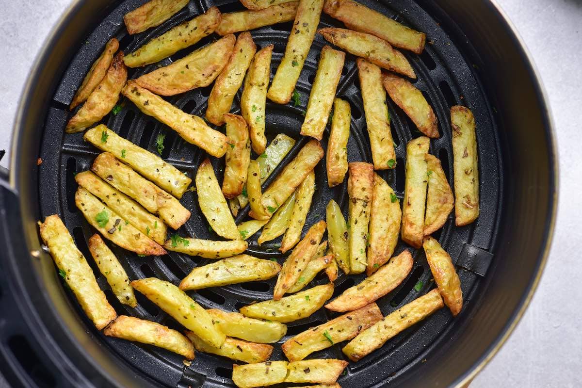 fries in the air fryer basket.