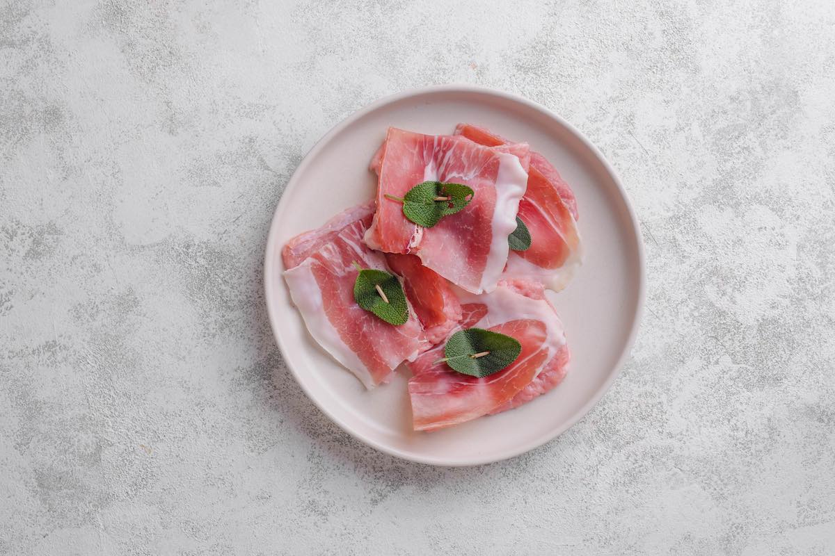 assembled uncooked veal saltimbocca.