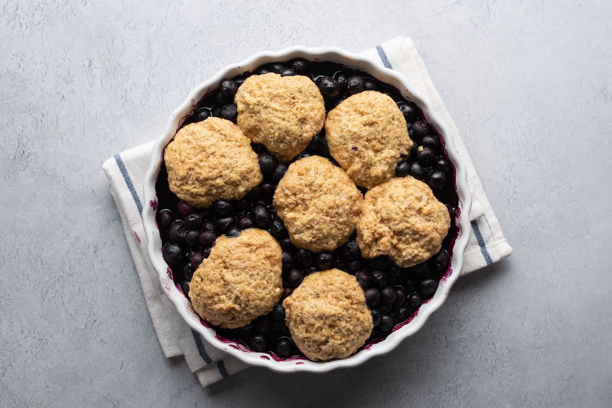 biscuit dough on top of blueberries.