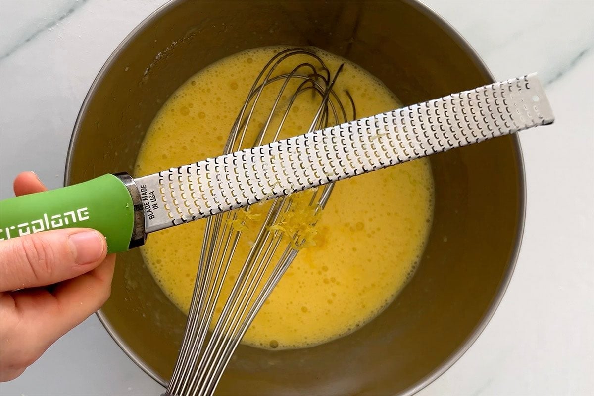 lemons, eggs, and allulose whisked in the bowl.