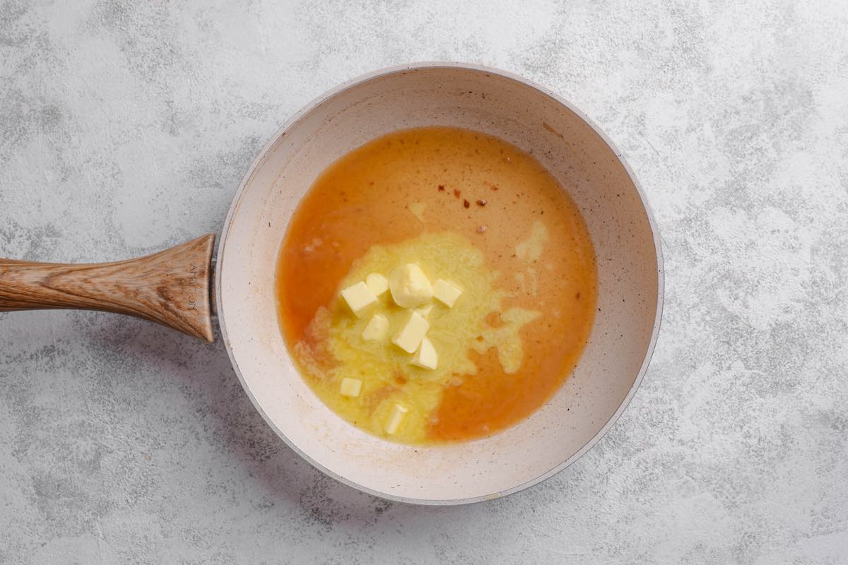butter and wine deglazing in pan.