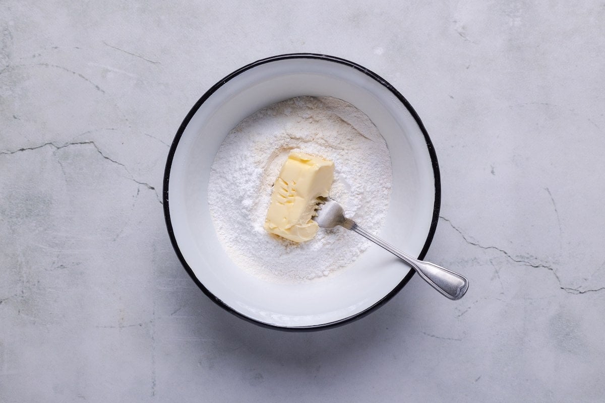 dry ingredients and butter in mixing bowl.
