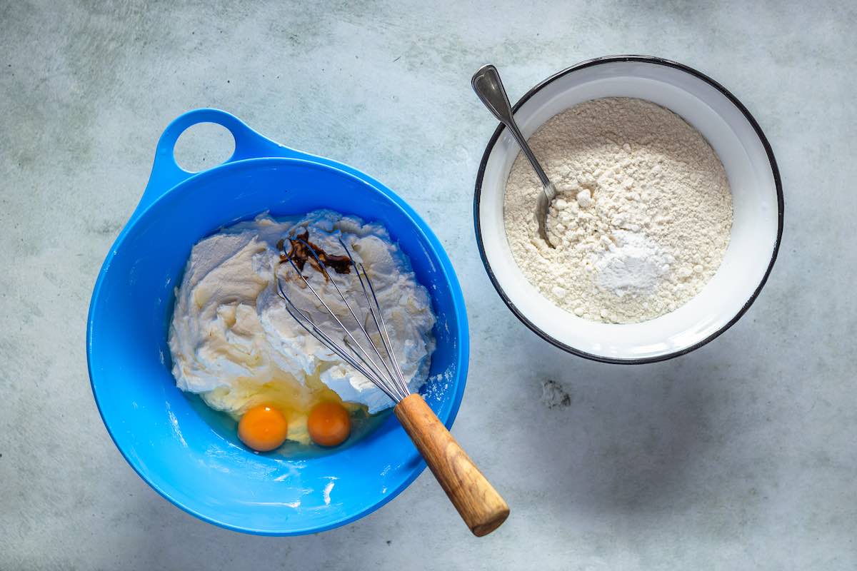dry ingredients in a bowl with wet ingredients in a second bowl.