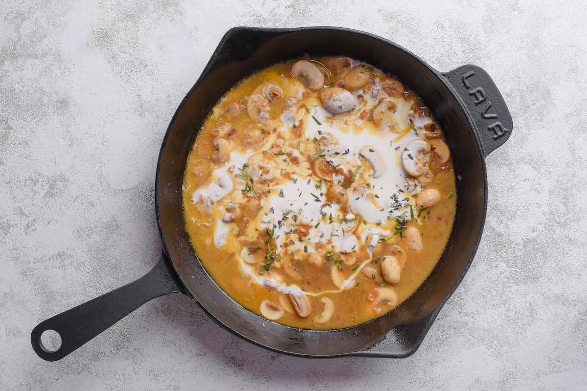 creamy veal marsala sauce in a skillet.