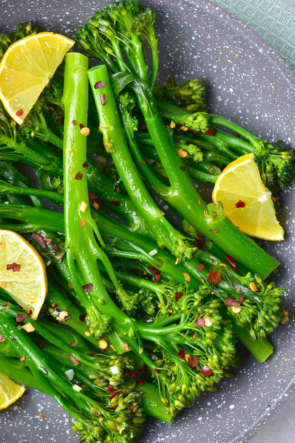 sauteed broccolini with fresh lemon slices and chili flakes.