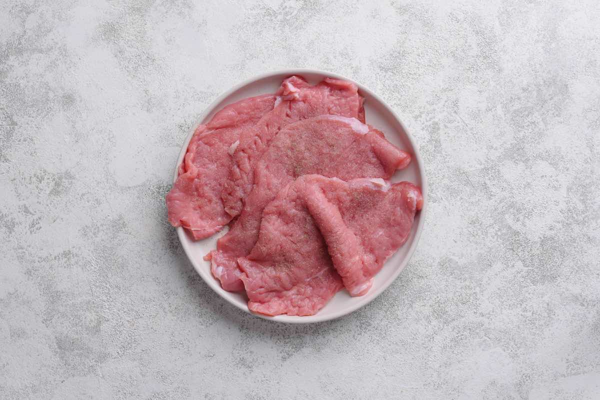 seasoned raw veal cutlets.