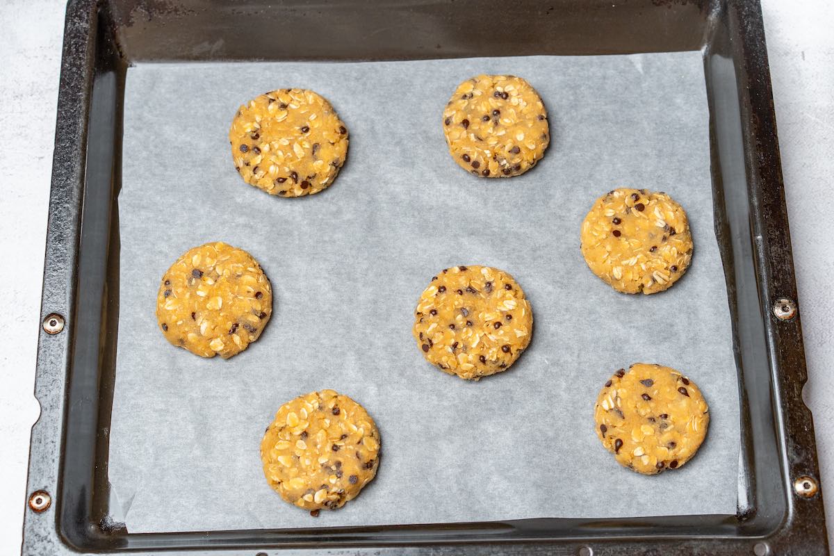 shaped unbaked cookies on baking sheet.