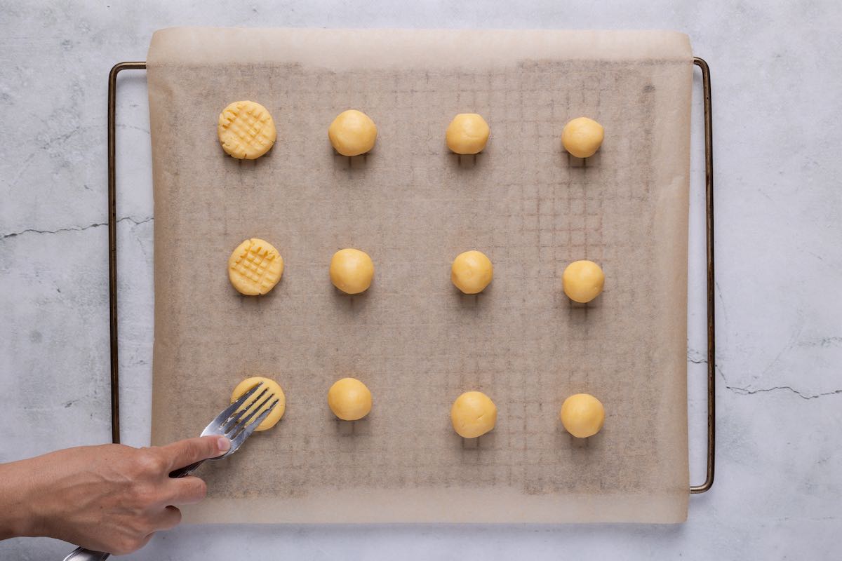 shaped unbaked cookies on baking sheet.