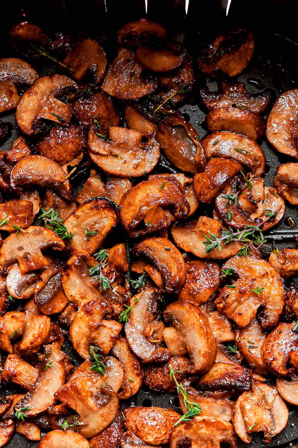 air fryer mushrooms in the air fryer basket.