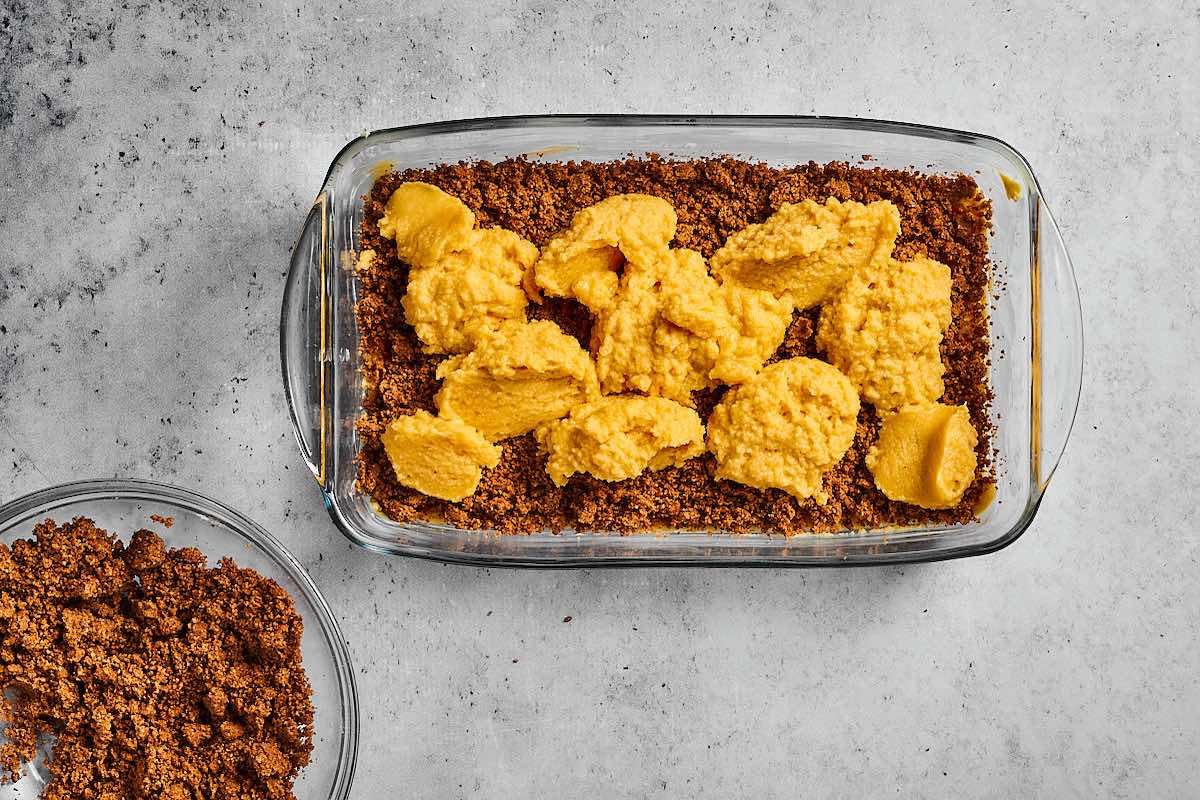 layering keto coffee cake in a pan.