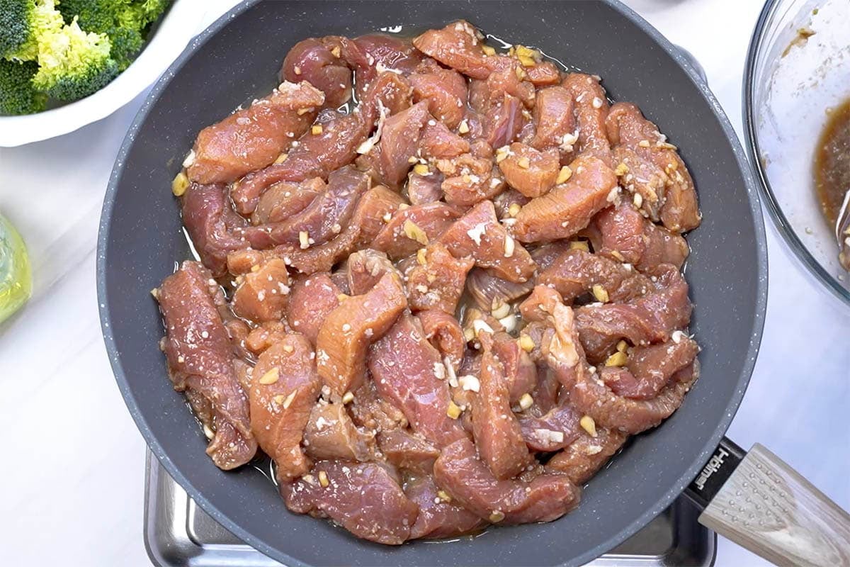 cooking beef in a skillet.
