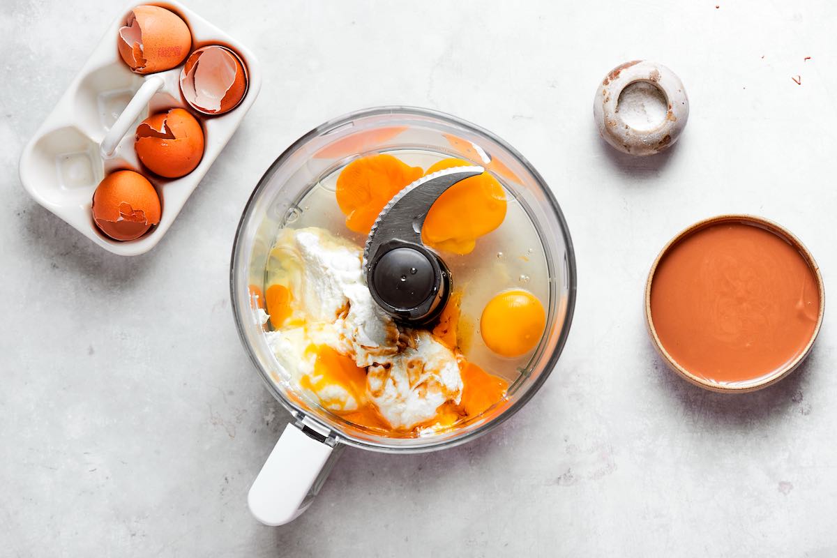food processor with eggs and cottage cheese.
