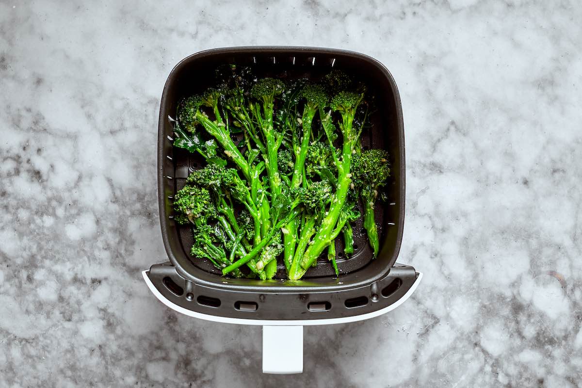 seasoned raw broccolini in the air fryer.