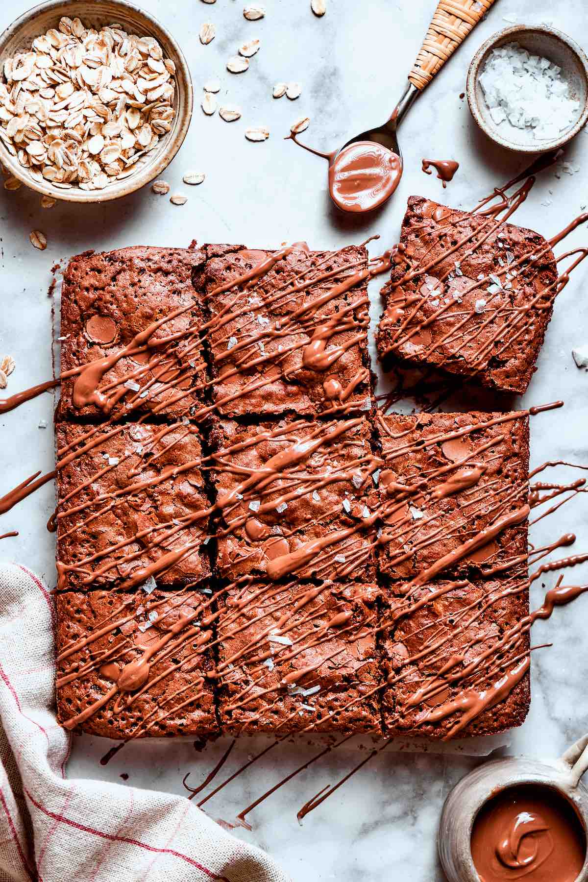 brownie baked oatmeal with melted chocolate drizzled on top.