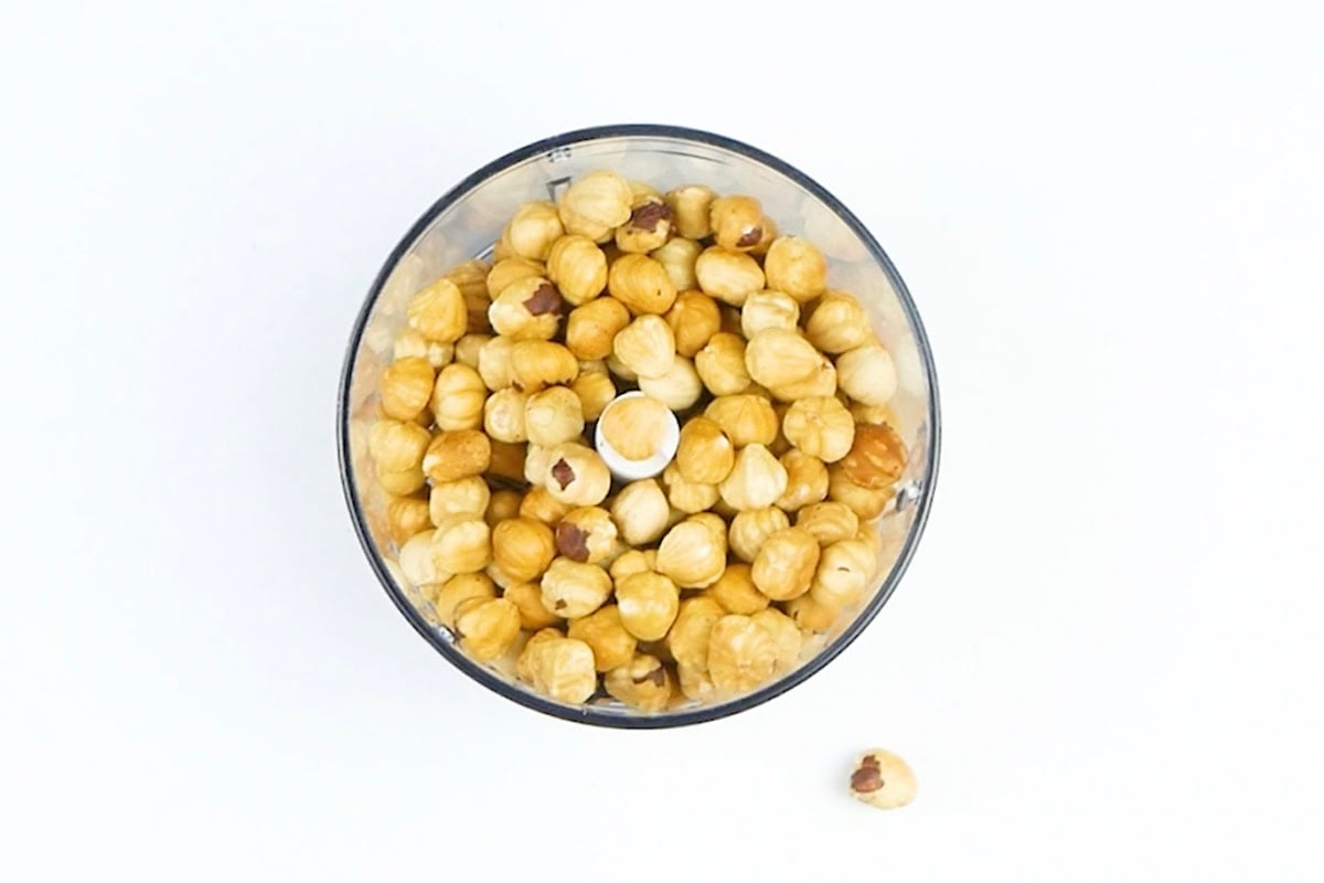 raw hazelnuts in a food processor.