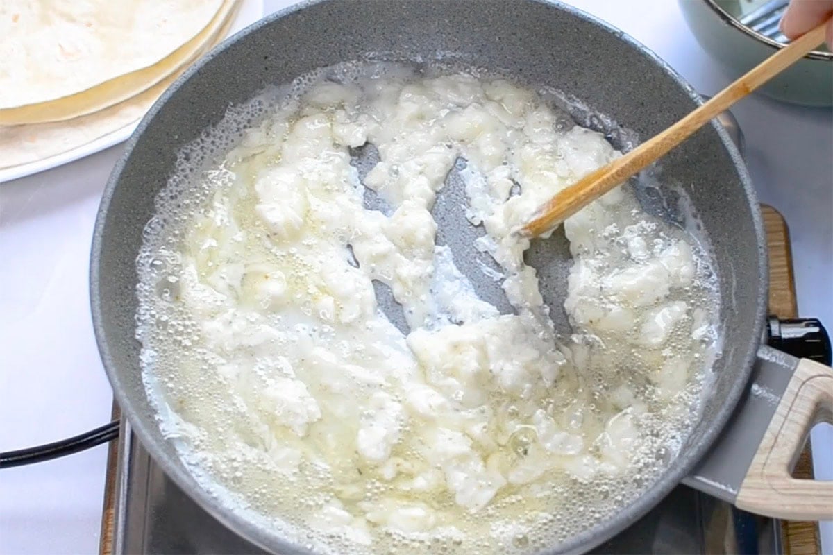 egg whites scrambling in pan.