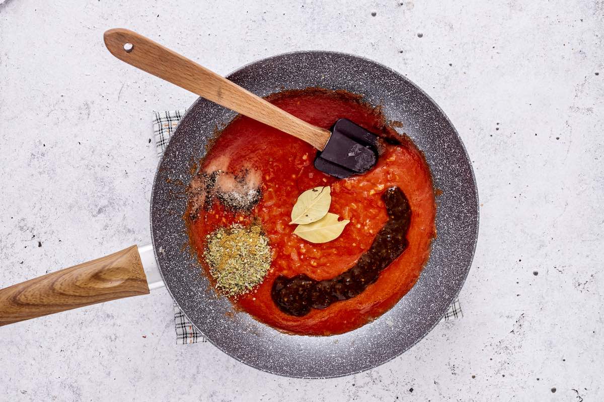 building tinga sauce in a skillet.