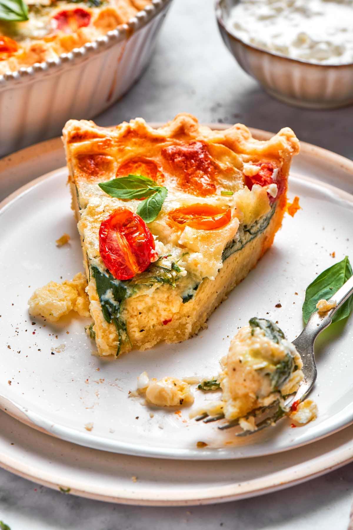 slice of cottage cheese quiche on a plate.