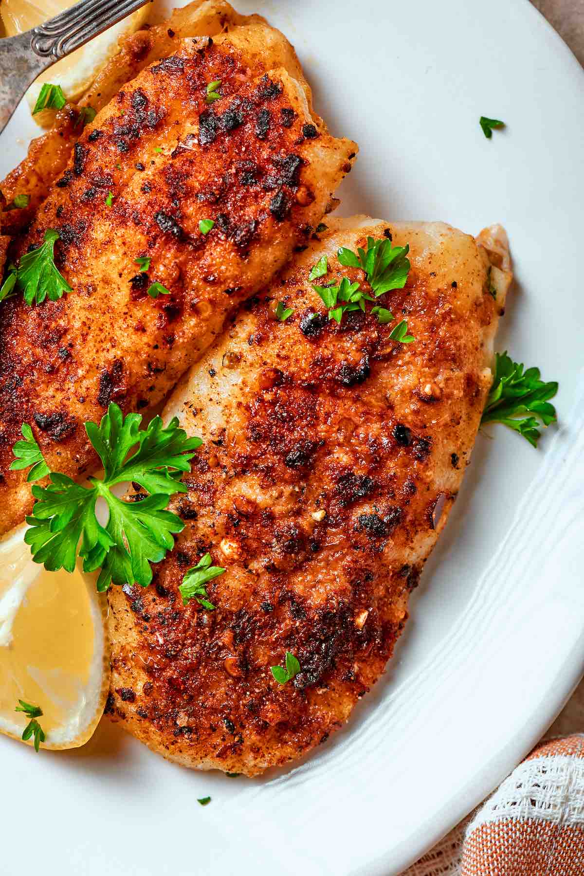 air fryer flounder with fresh parsley on top.