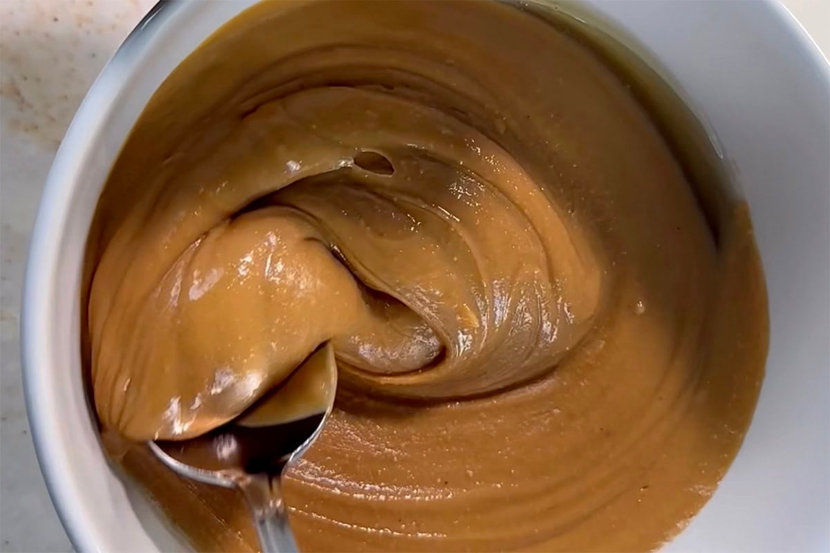 peanut butter and maple syrup melted together in a bowl.
