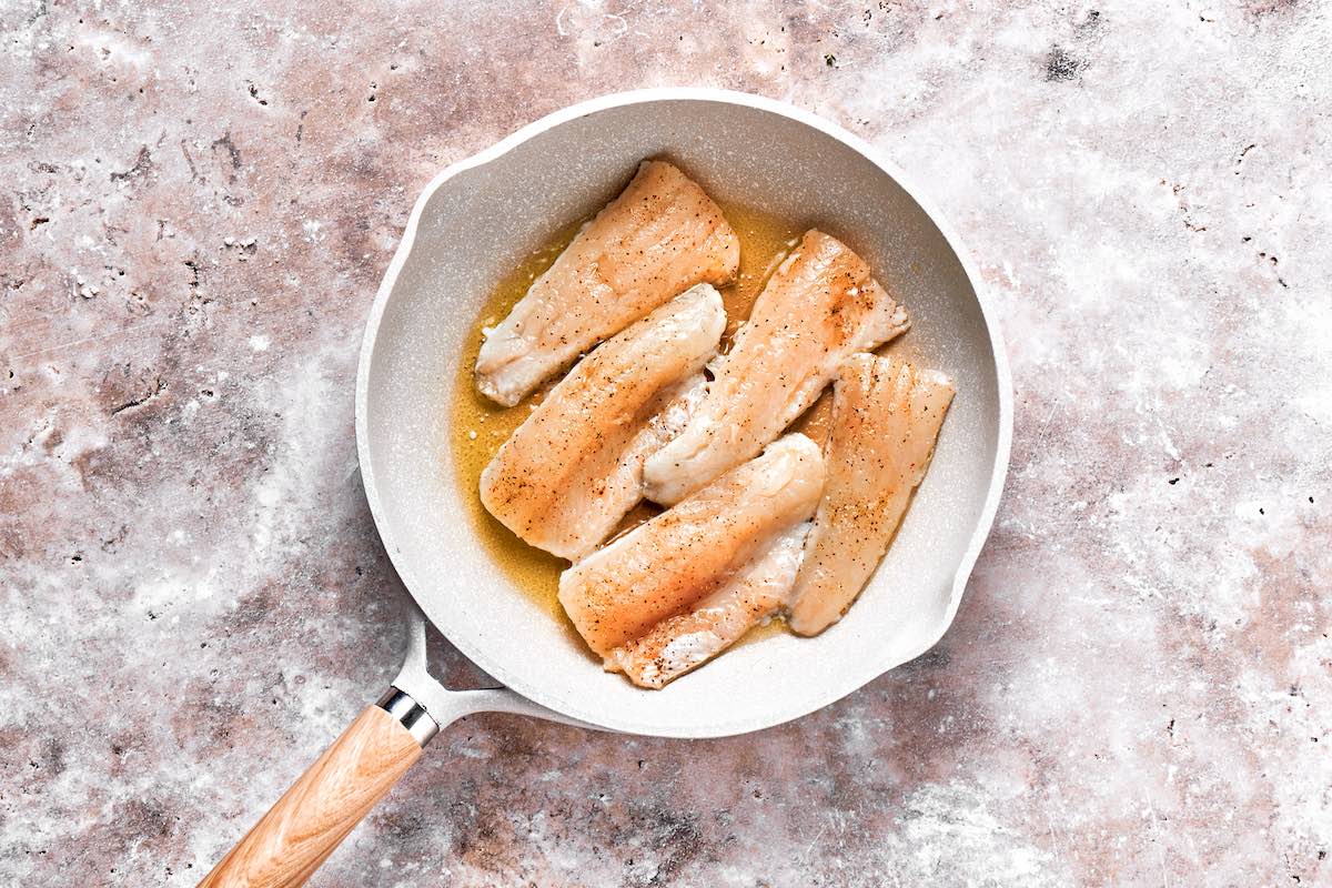 pan searing perch in a skillet with olive oil.
