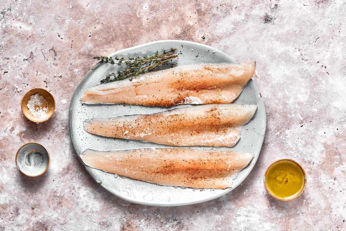seasoned raw perch fillets with salt and pepper.