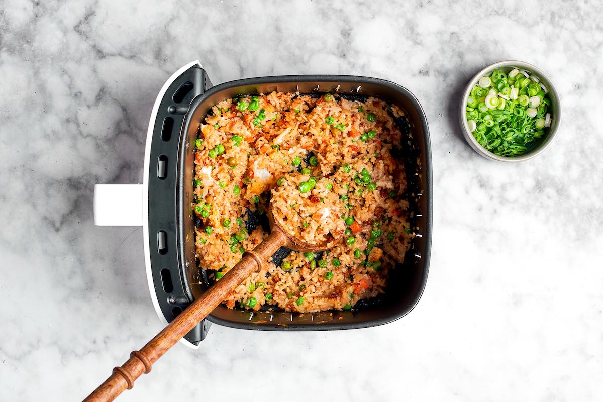 mixing scrambled egg into rice.