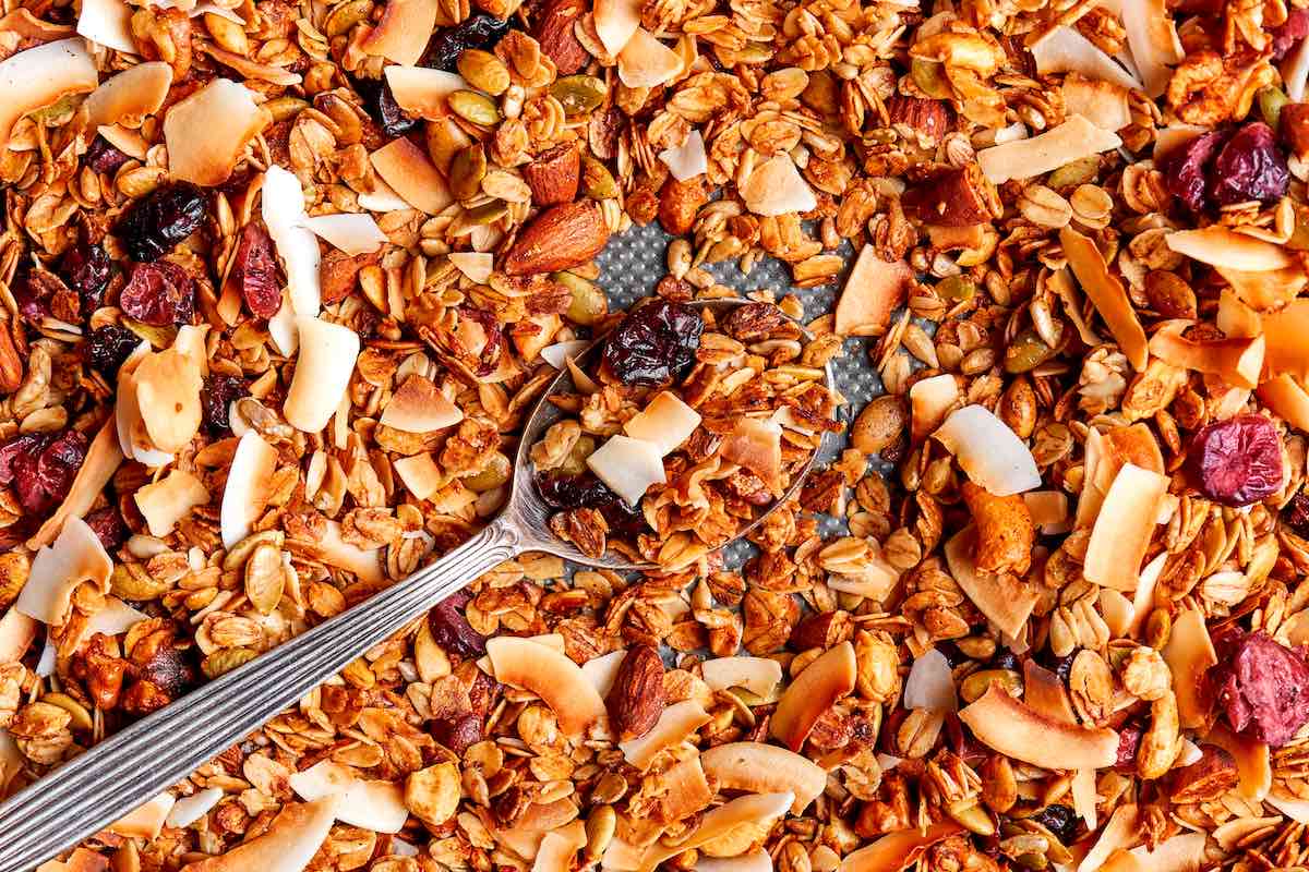 air fryer granola cooling on a baking sheet.