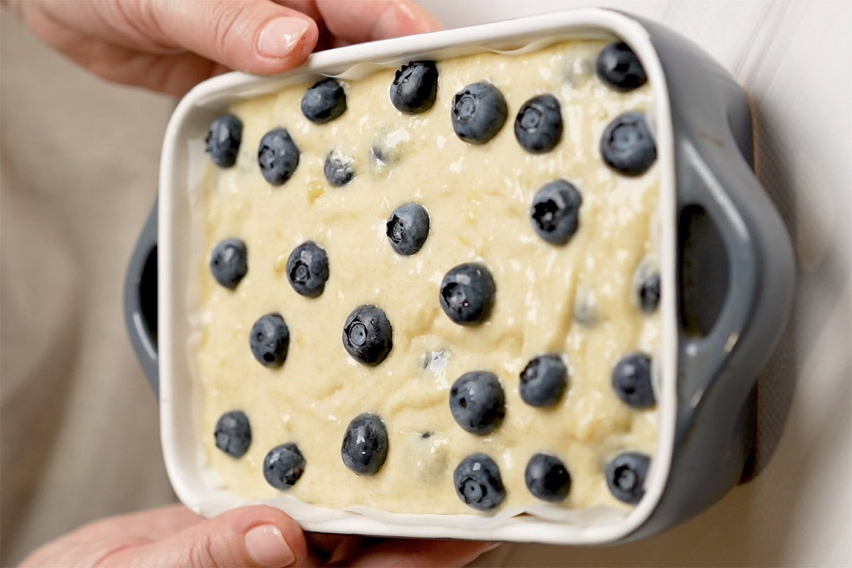 blueberry banana bread batter in baking dish.