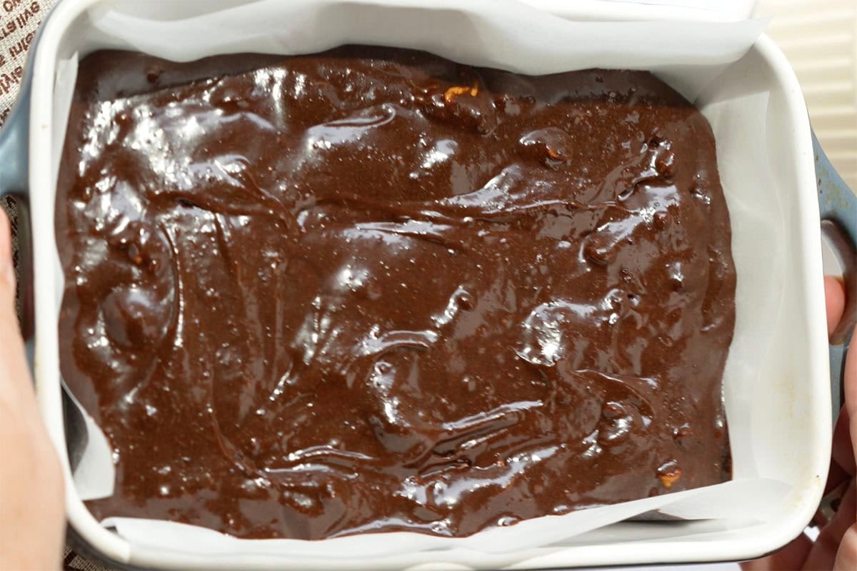 flourless brownie batter in a baking tin.