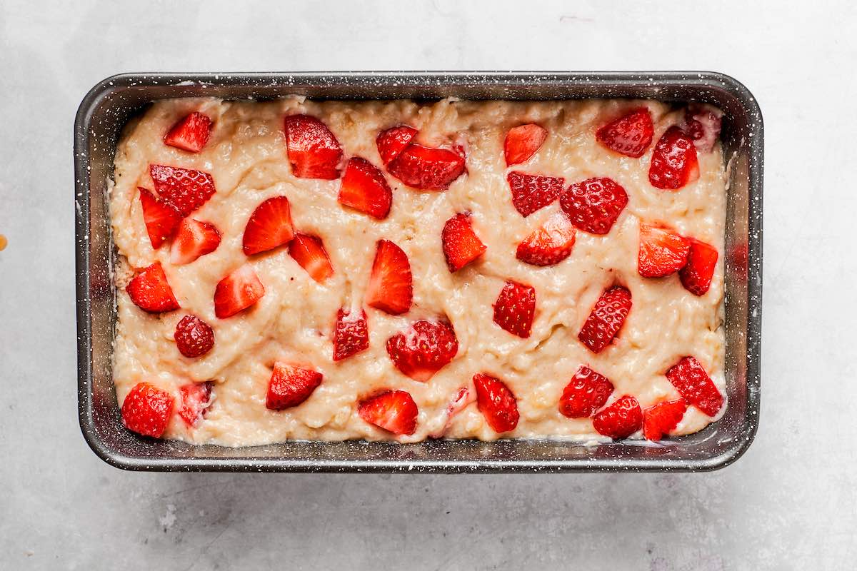 strawberry banana bread batter in a loaf tin.