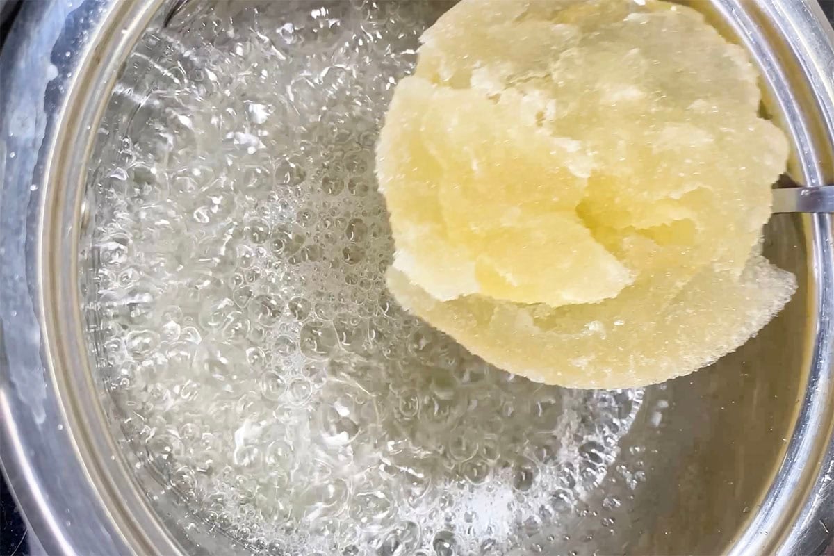 adding gelatin mixture to boiling water.