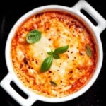 cottage cheese pizza bowl in an air fryer basket.