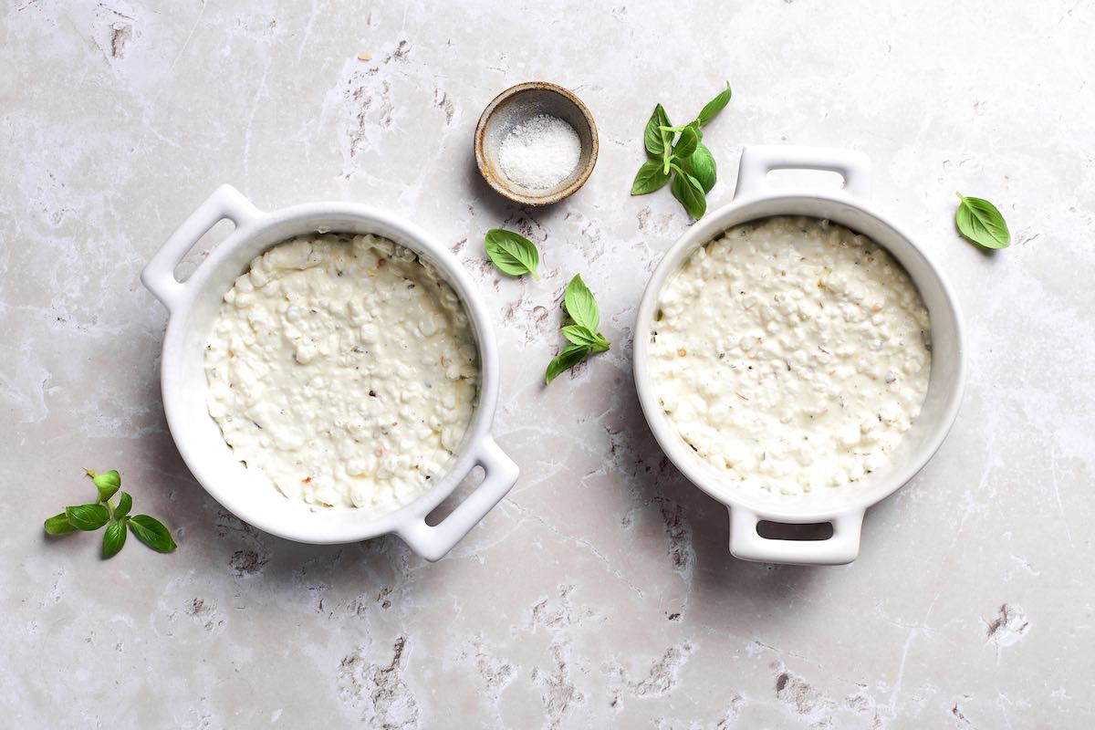 seasoned cottage cheese in two white ramekins.
