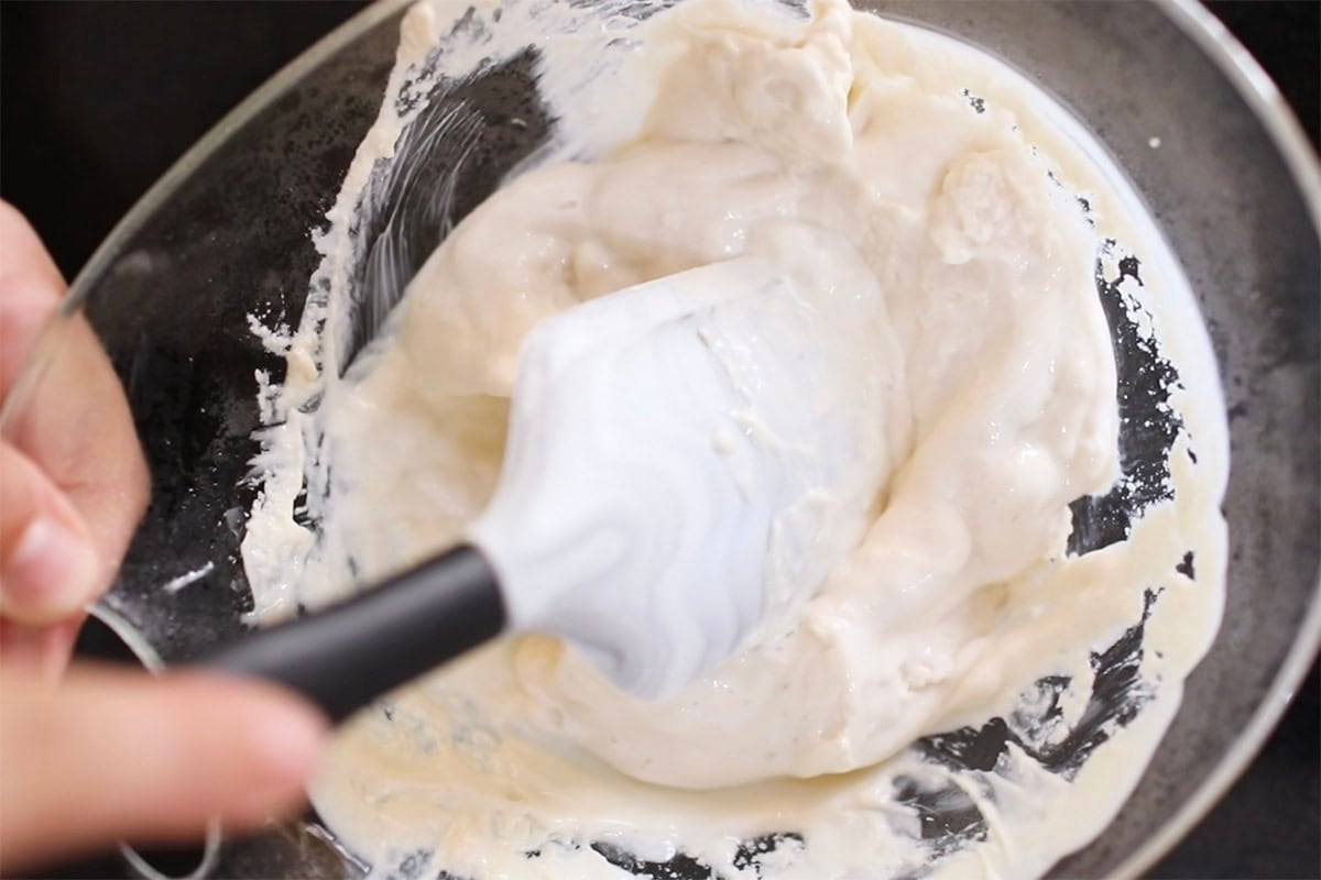 mixing frozen yogurt mixture in ice cream machine.