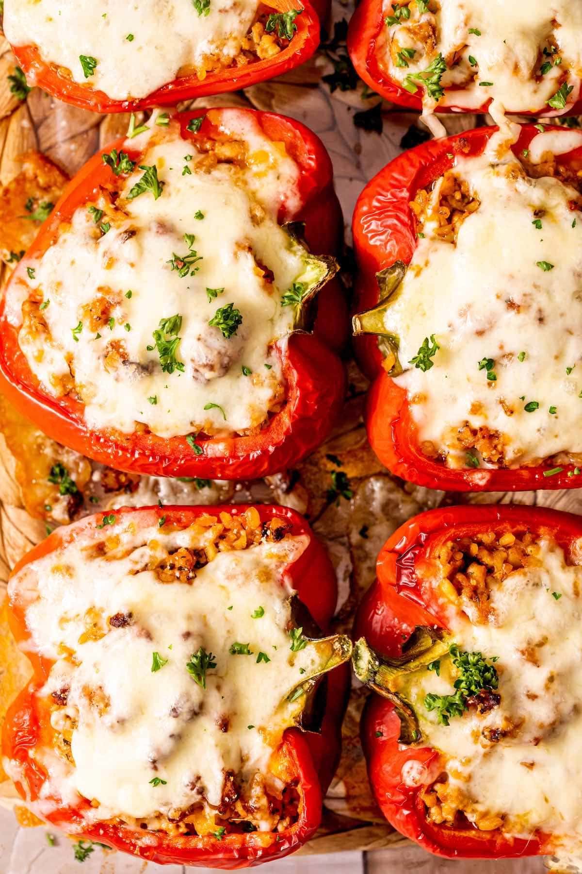 ground pork stuffed peppers in a baking dish.