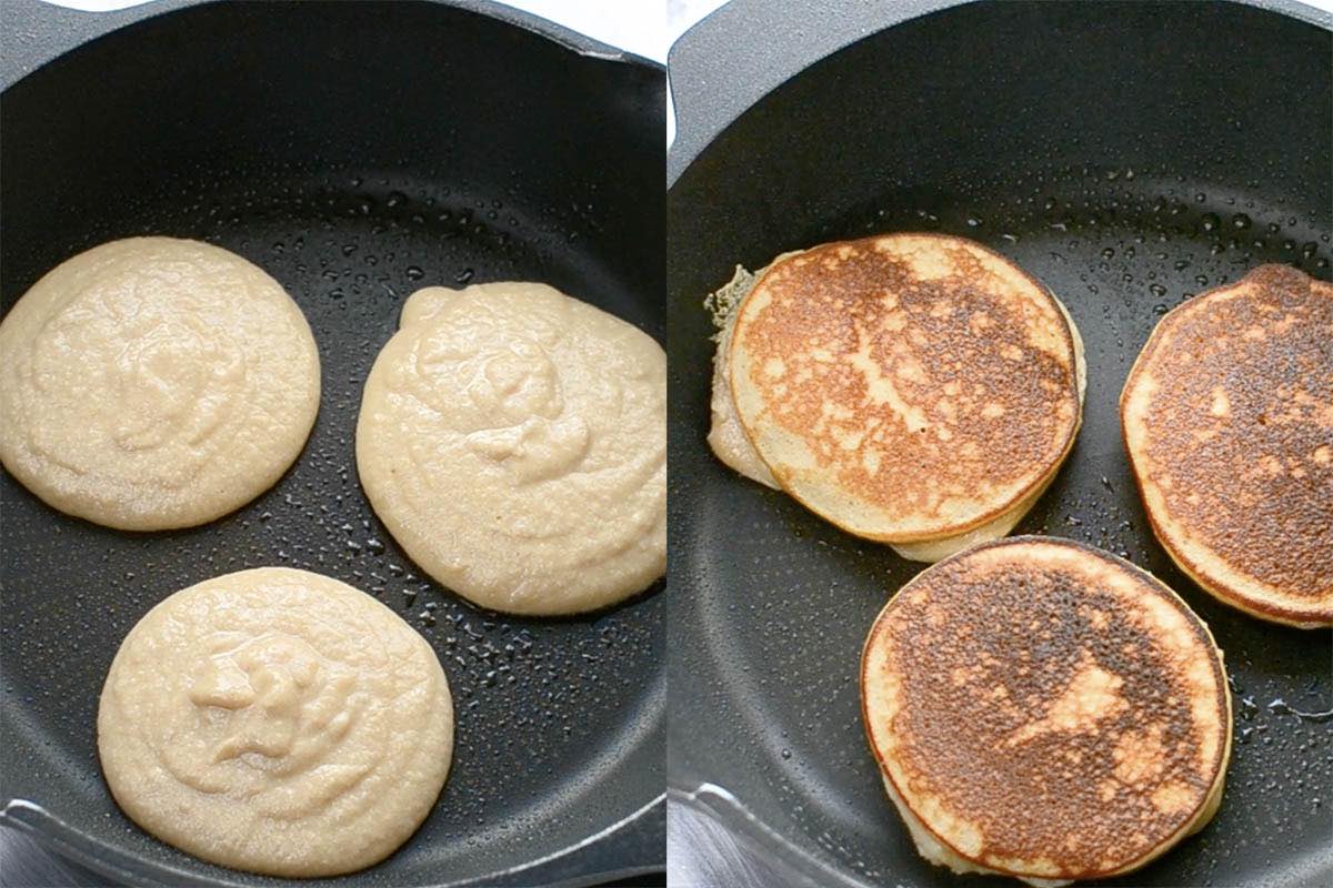 keto pancakes cooking in a large black skillet.