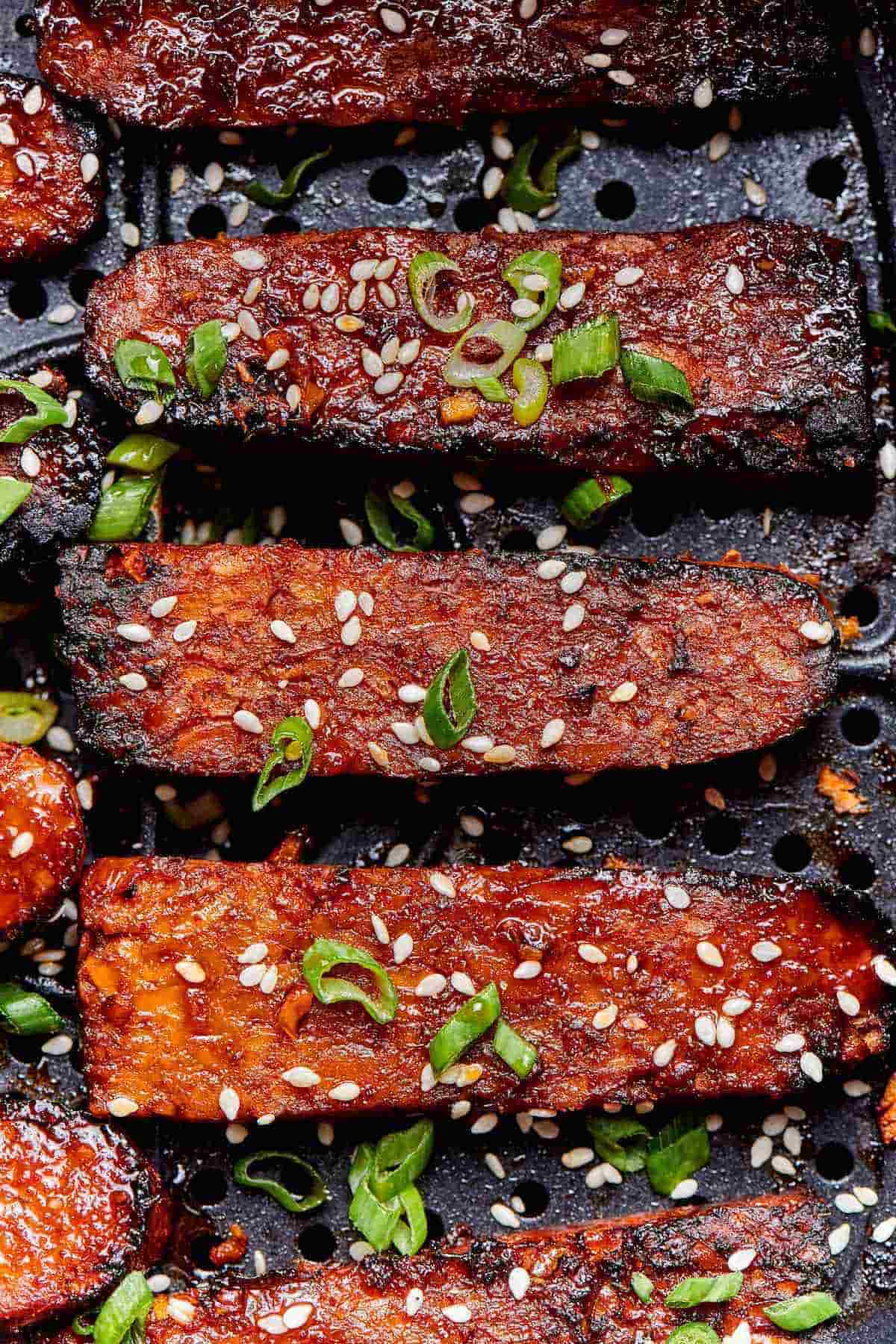 air fryer tempeh in the air fryer basket.