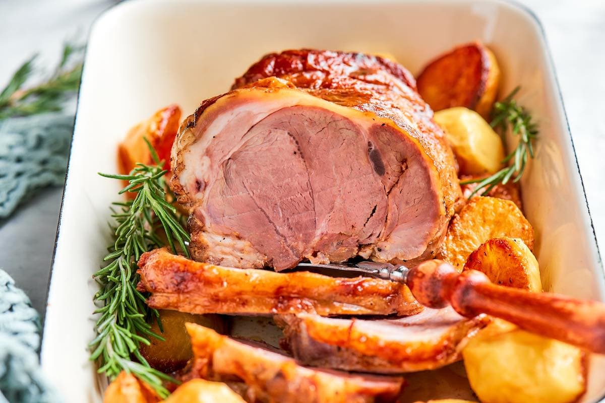 roasted boneless leg of lamb, carved.