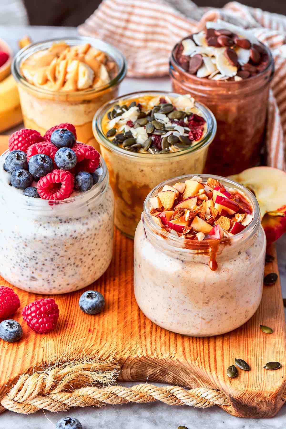 overnight oats recipe in five jars with five flavors.